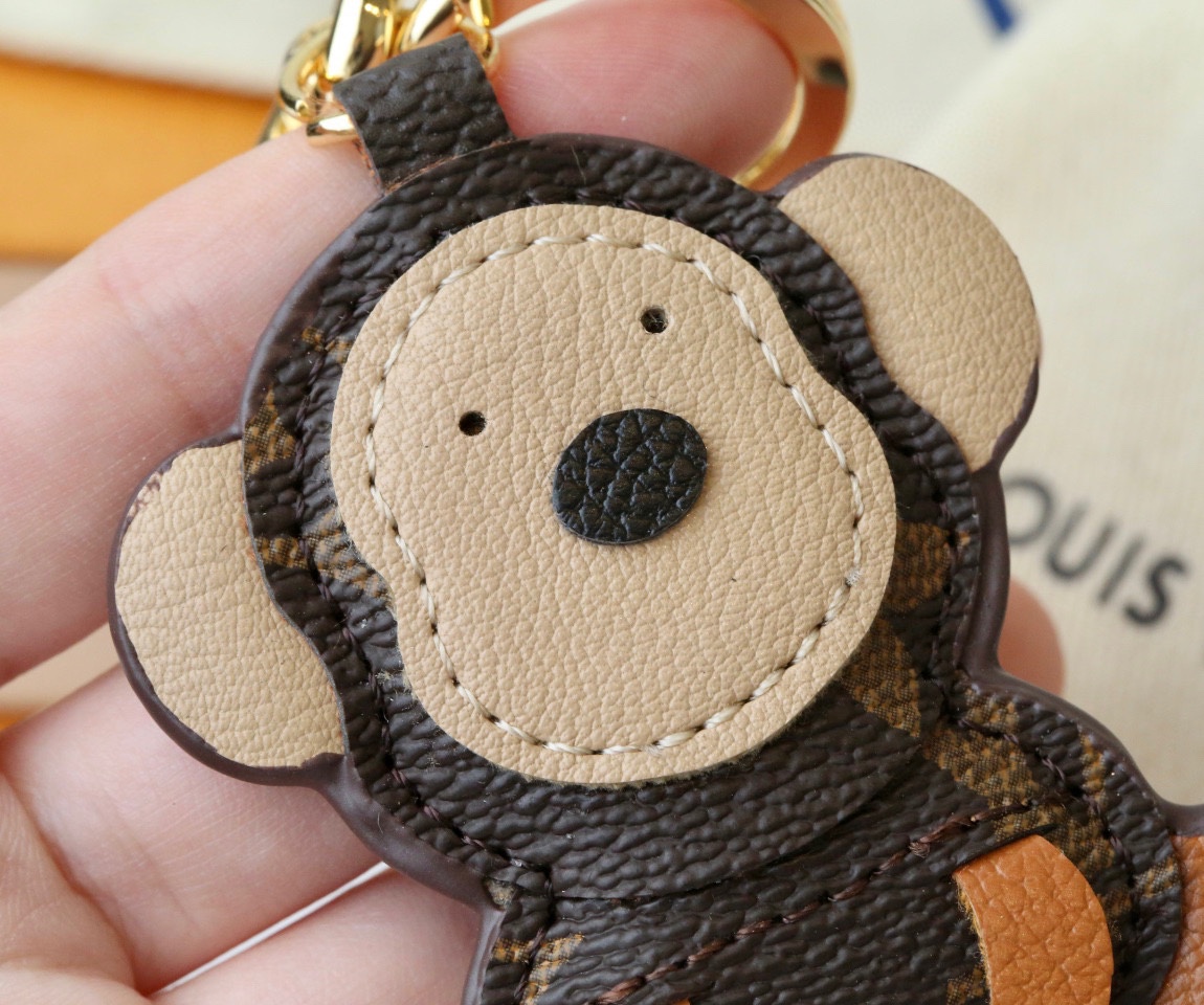 Back view of the coffee brown leather monkey keychain