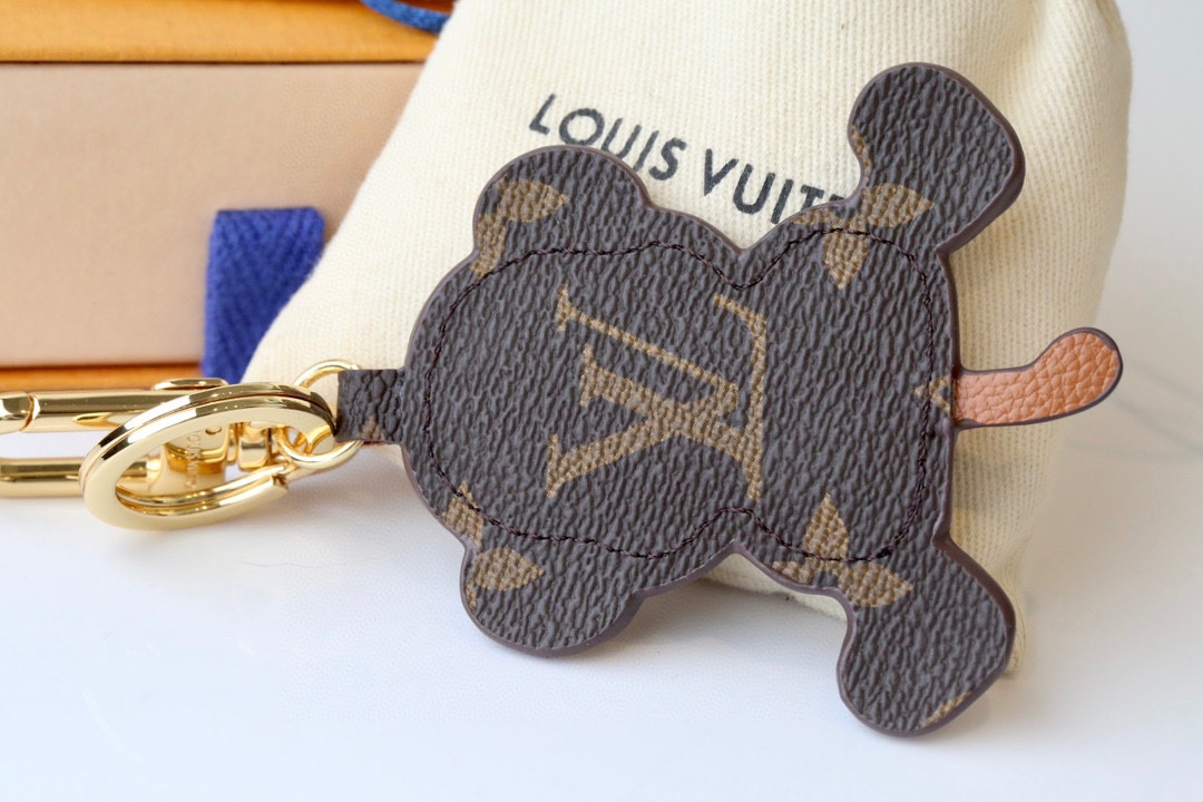 Leather Monkey Keychain held in a hand