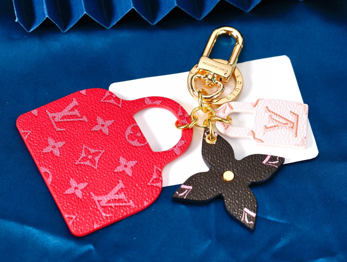 Black leather keychain with rhombus flower and red handbag charm