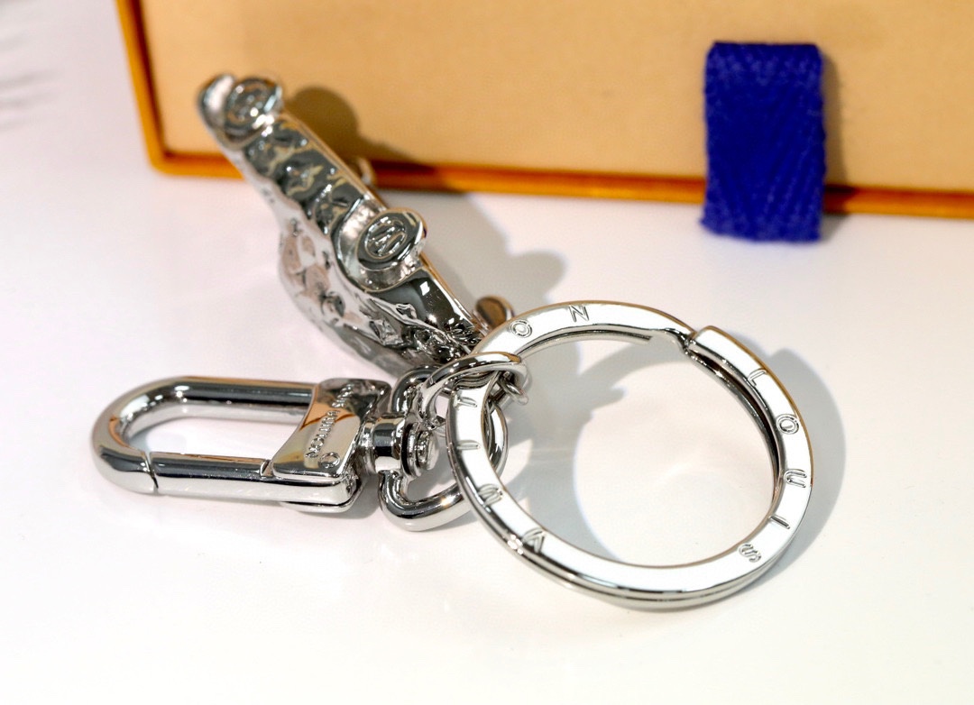 The keychain attached to a set of keys.