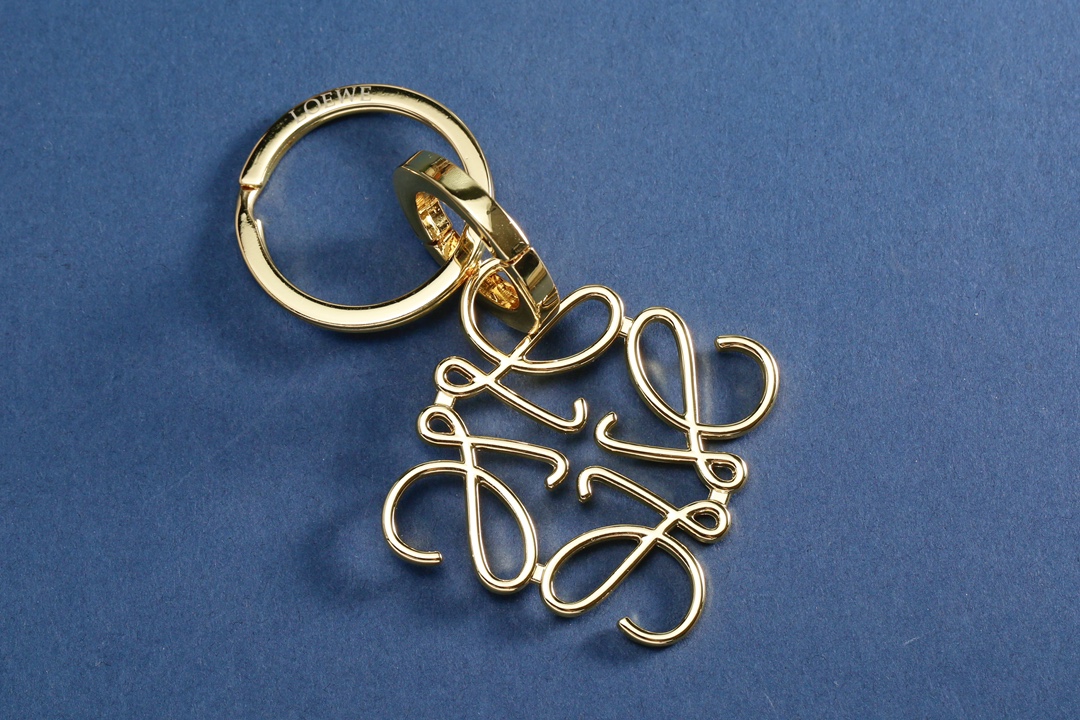 Front view of a luxury designer keychain used as a bag charm