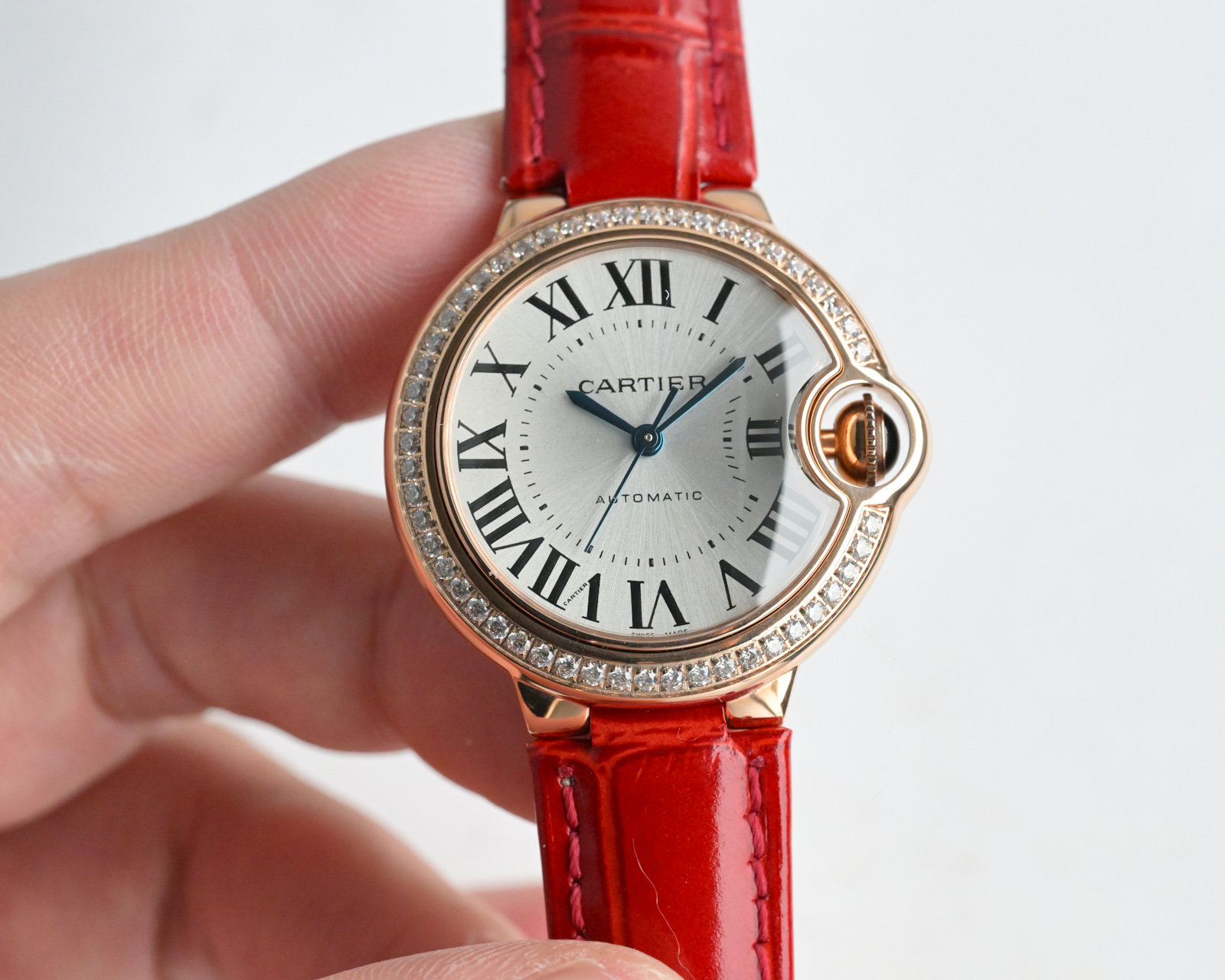 Cartier Ballon Bleu de Cartier rose gold case, diamond bezel, silver dial, red leather strap 33mm Women's Automatic
