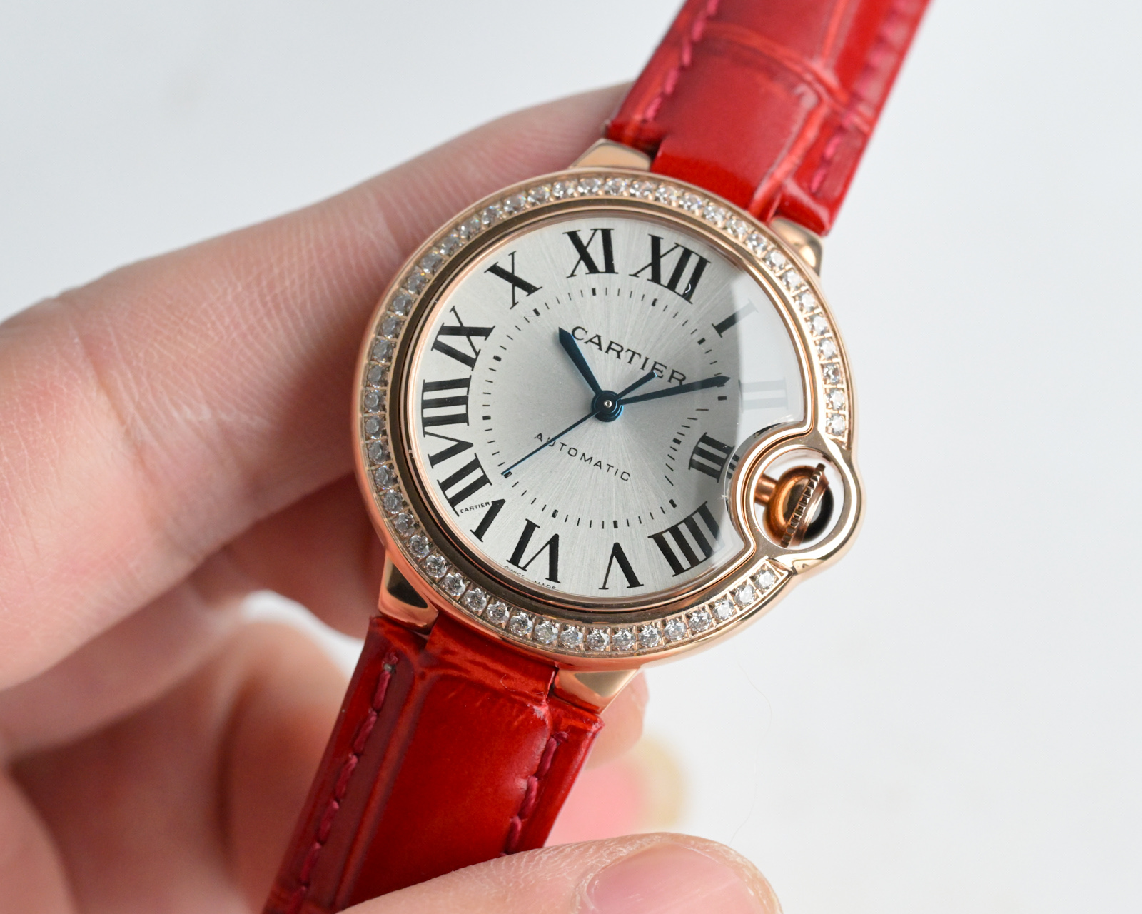Cartier Ballon Bleu de Cartier rose gold case, diamond bezel, silver dial, red leather strap 33mm Women's Automatic