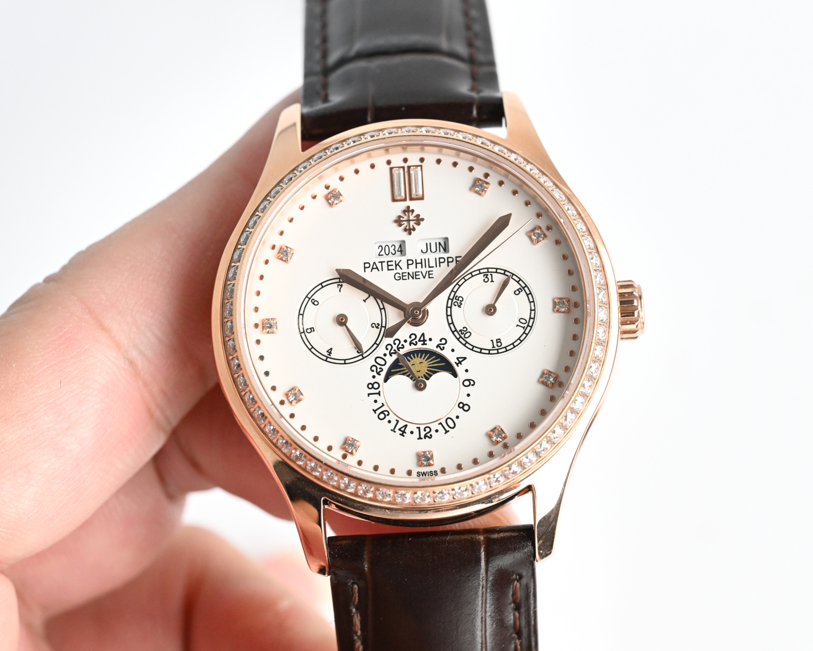 Patek Philippe Complications Annual Calendar Moon Phases 4947 / 200G white gold case with diamond bezel, white dial, black leather strap 38mm Women's Automatic