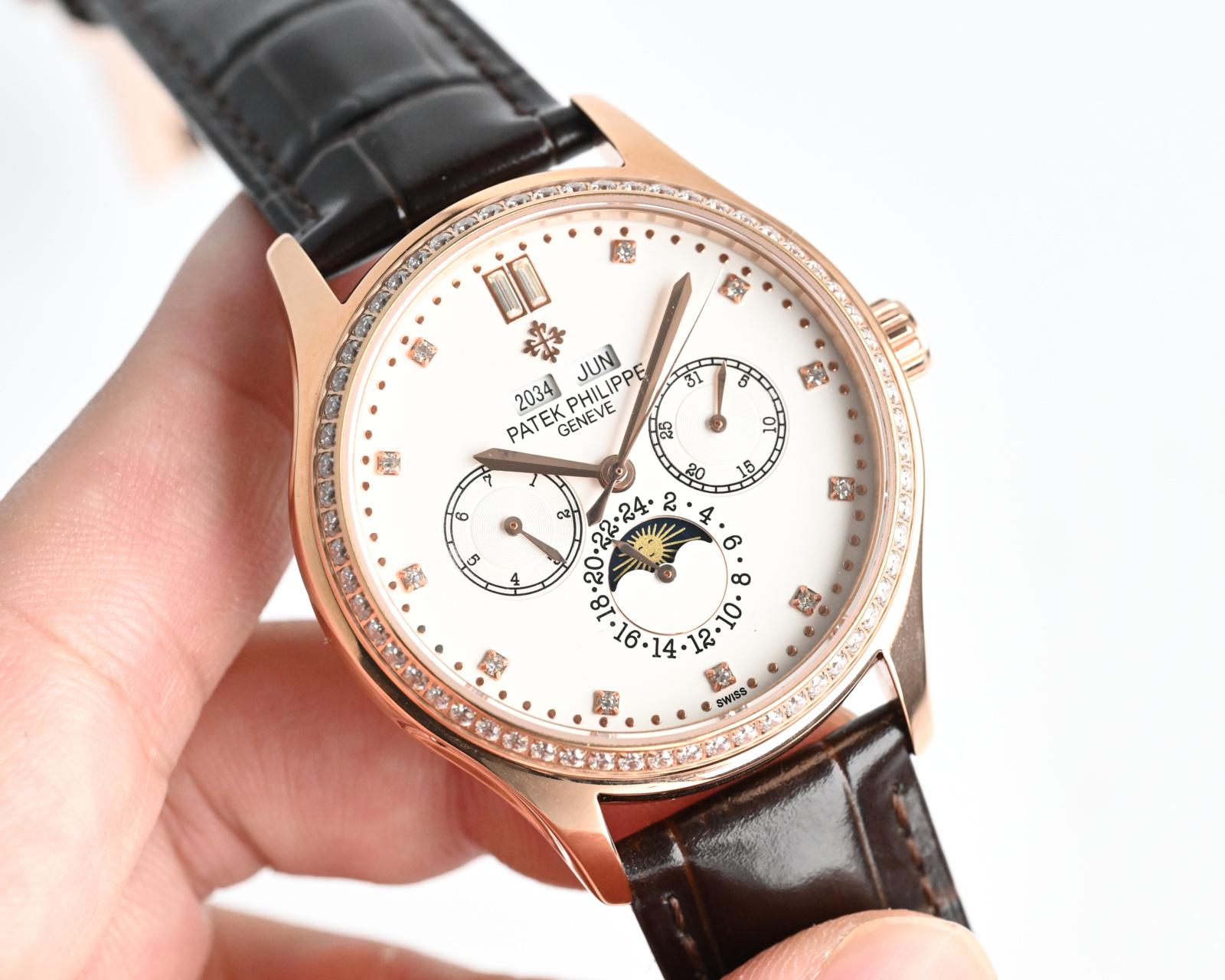 Patek Philippe Complications Annual Calendar Moon Phases 4947 / 200G white gold case with diamond bezel, white dial, black leather strap 38mm Women's Automatic