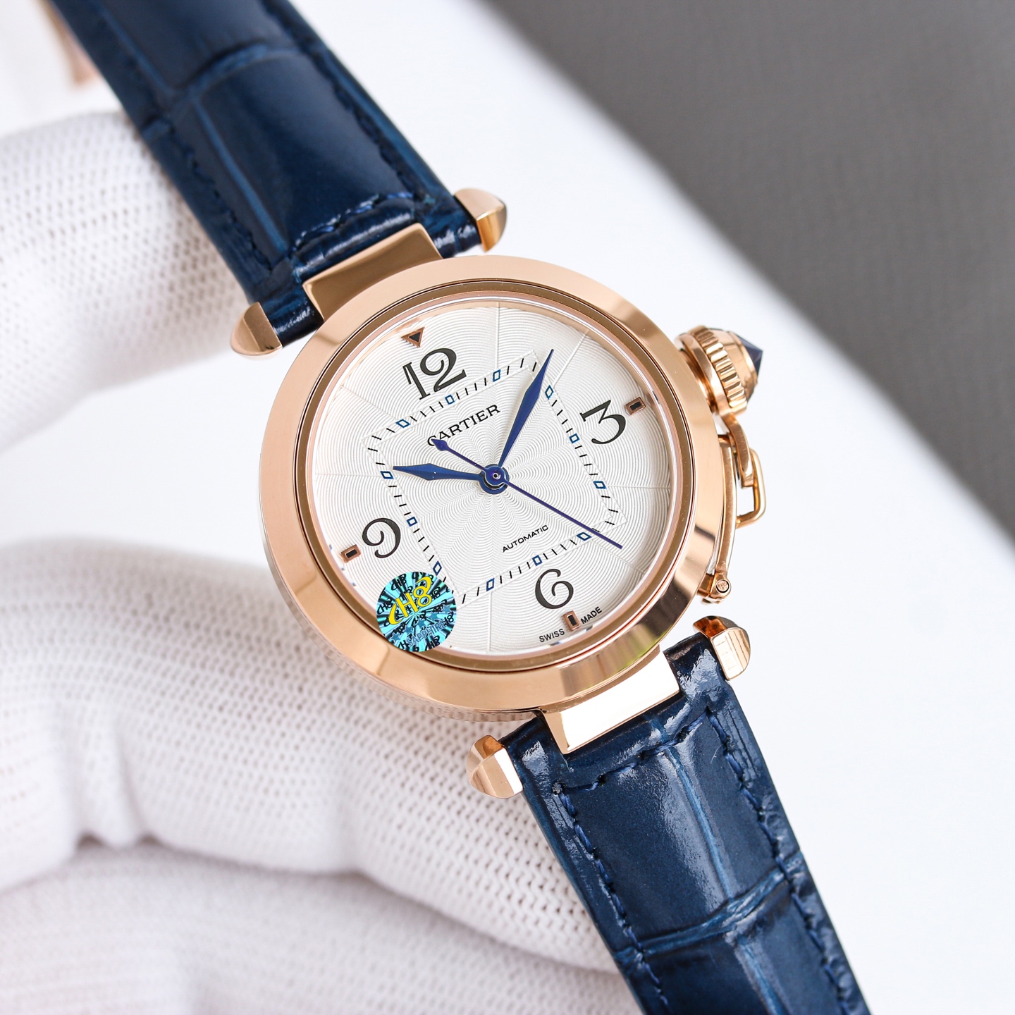 Cartier Pasha de Cartier stainless steel case and bezel, silver guilloche dial, blue leather strap 32mm Unisex Automatic