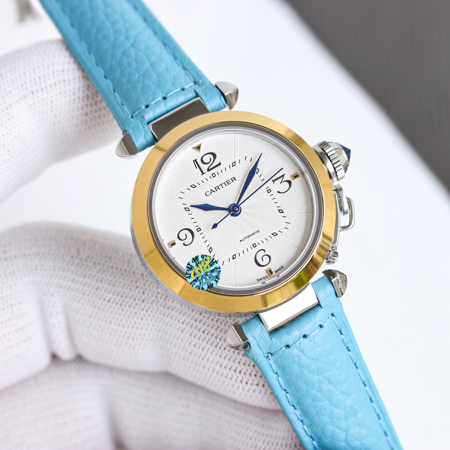 Cartier Pasha de Cartier stainless steel case and bezel, silver guilloche dial, blue leather strap 32mm Unisex Automatic