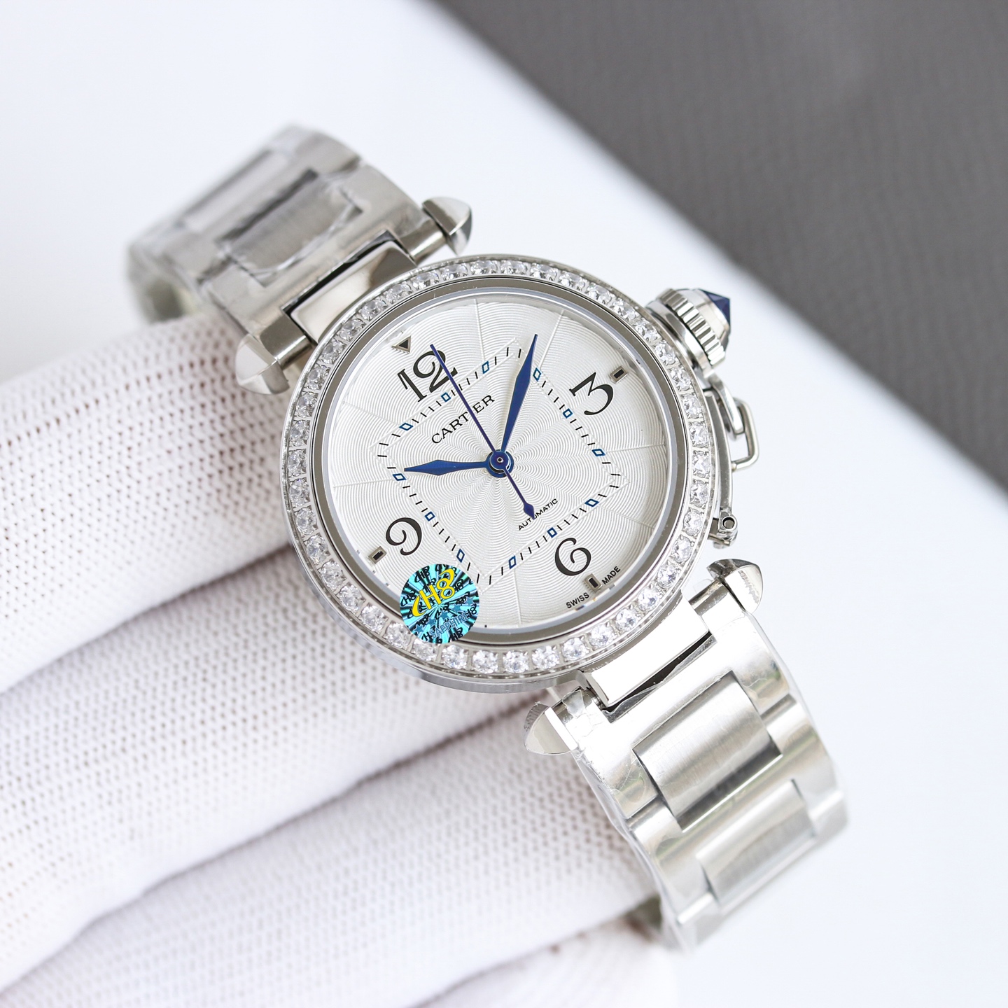 Cartier Pasha de Cartier 32mm stainless steel case and bracelet, silver guilloche dial, blue hands and cabochon crown 32mm Women's Automatic