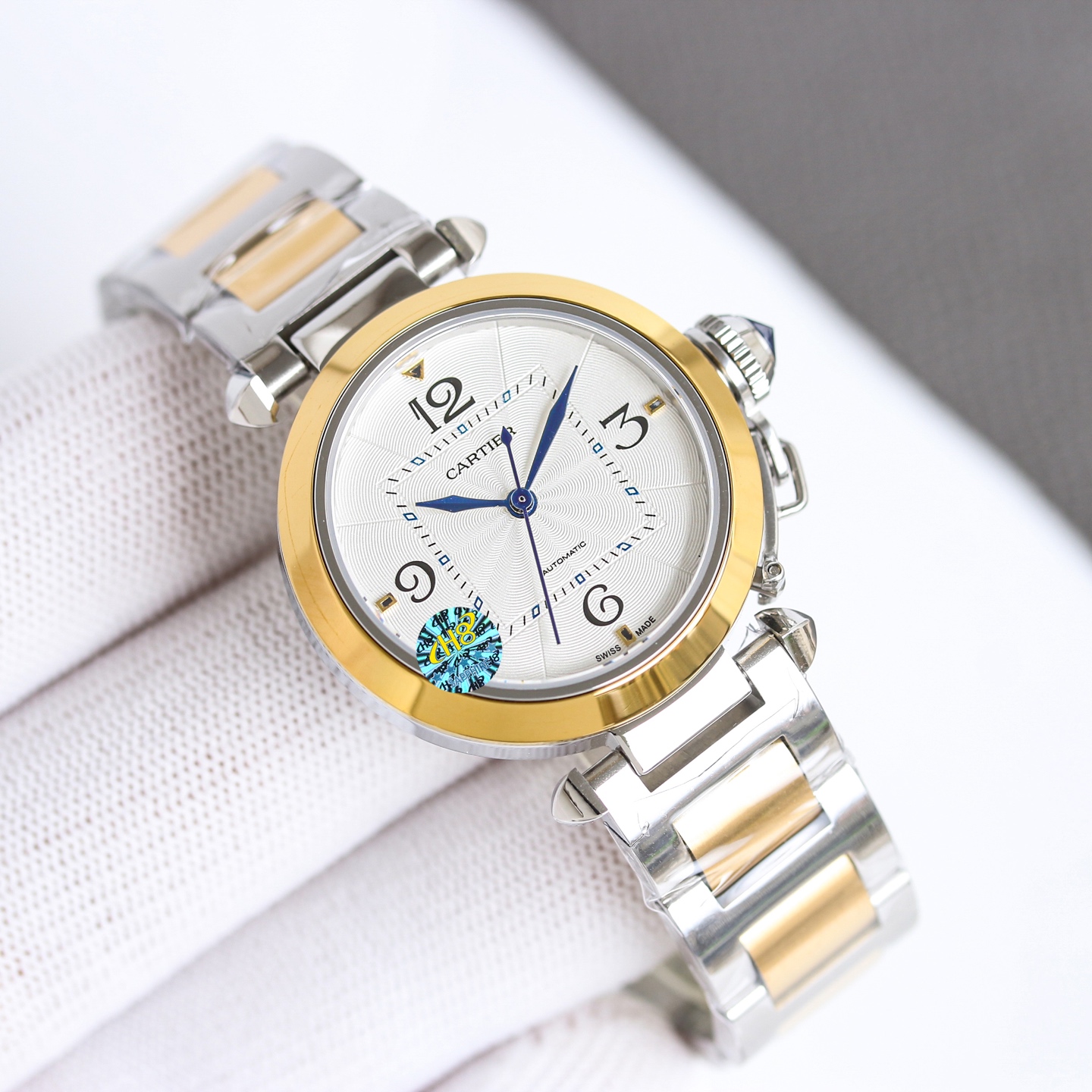 Cartier Pasha de Cartier 32mm stainless steel case and bracelet, silver guilloche dial, blue hands and cabochon crown 32mm Women's Automatic