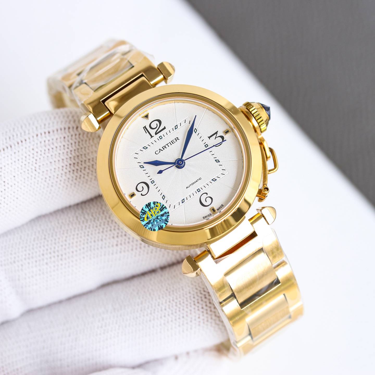 Cartier Pasha de Cartier 32mm stainless steel case and bracelet, silver guilloche dial, blue hands and cabochon crown 32mm Women's Automatic