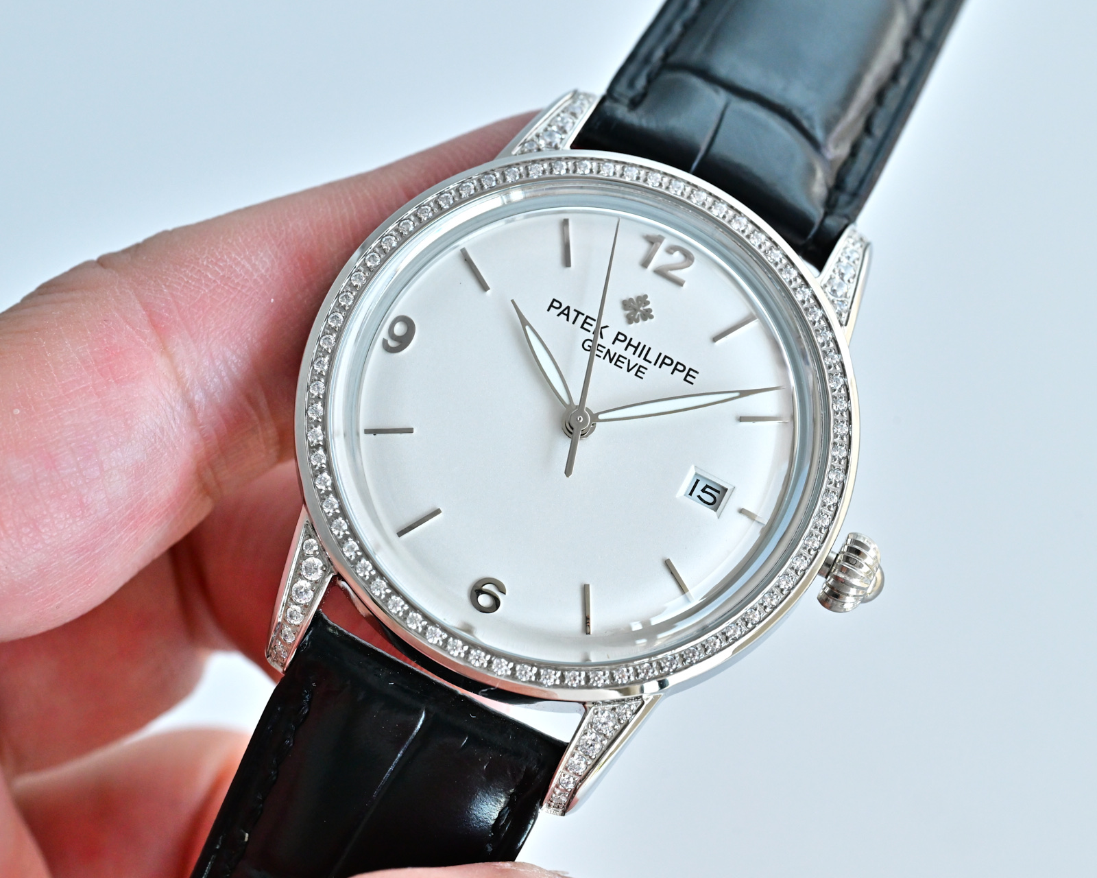 Patek Philippe Calatrava 4897 / 300G white gold diamond-set case and bezel, silver dial, black leather strap 33mm Women's Automatic
