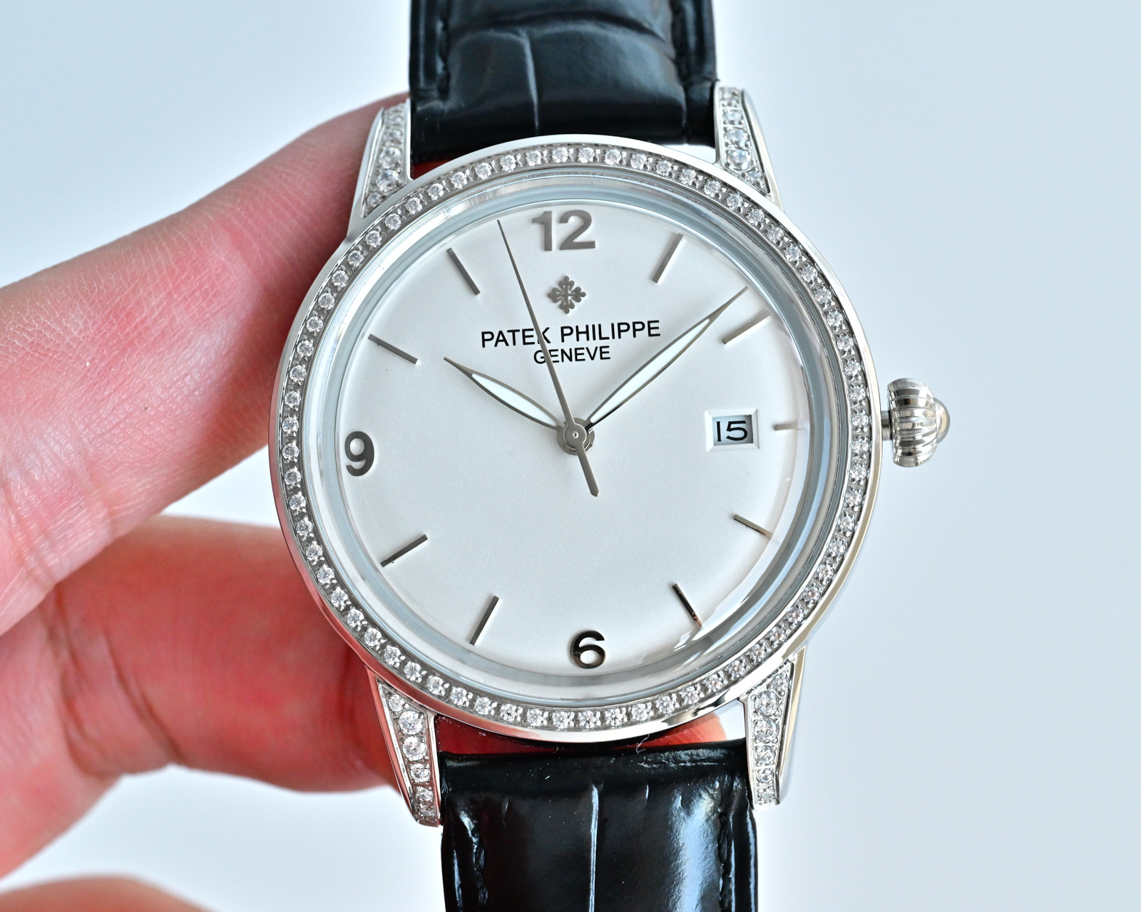 Patek Philippe Calatrava 4897 / 300G white gold diamond-set case and bezel, silver dial, black leather strap 33mm Women's Automatic