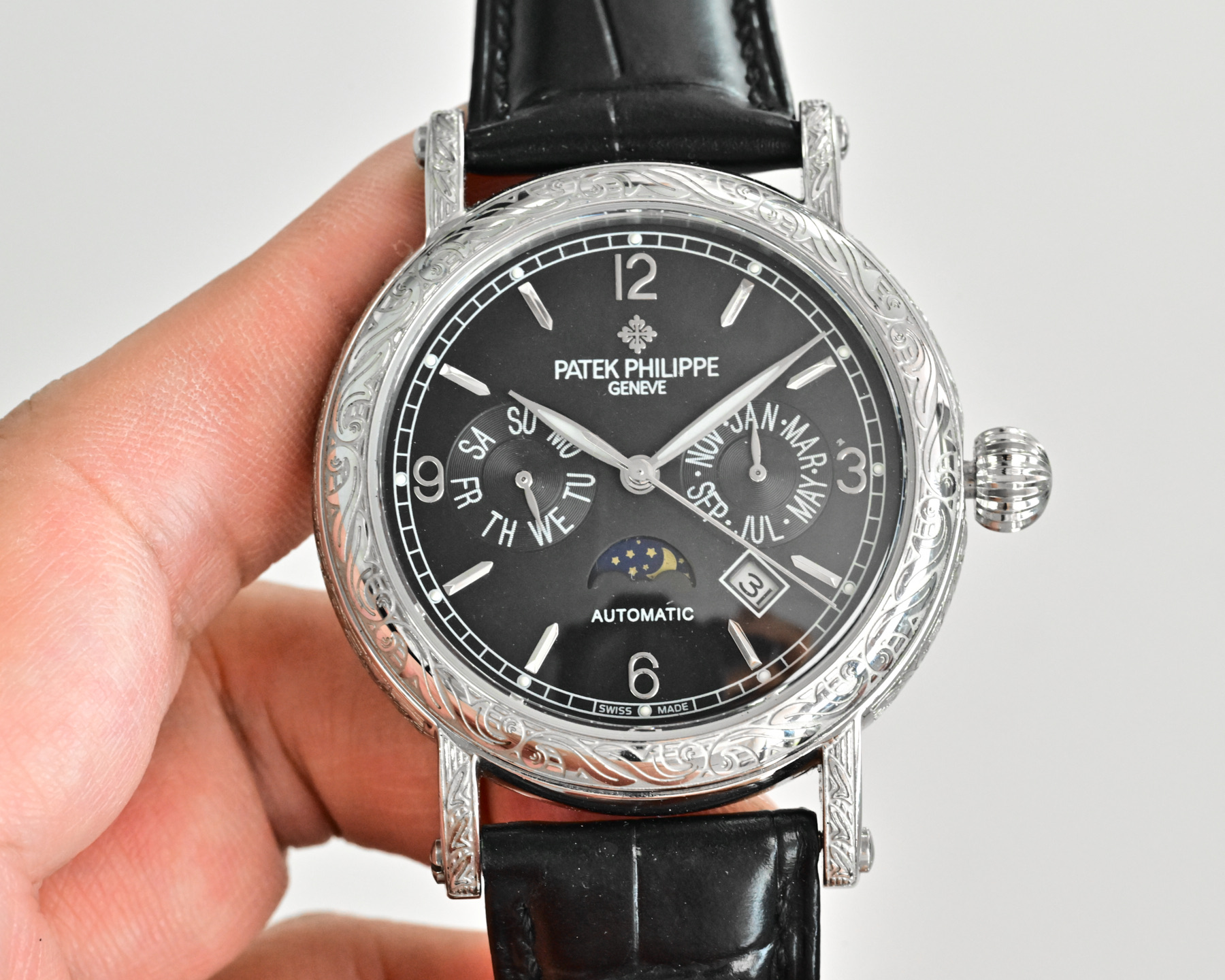 Patek Philippe Complications Annual Calendar Moon Phases 4968G white gold diamond-set case bezel, black dial, black leather strap 42mm Women's Automatic