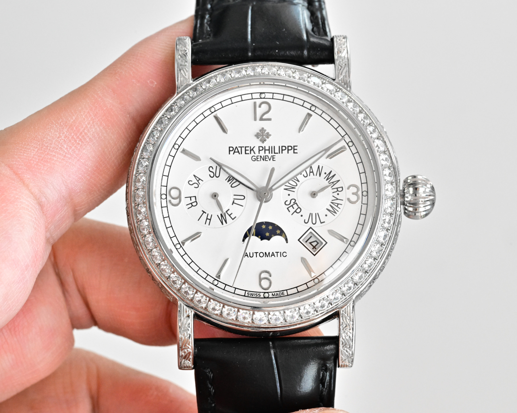 Patek Philippe Complications Annual Calendar Moon Phases 4968G white gold diamond-set case bezel, black dial, black leather strap 42mm Women's Automatic