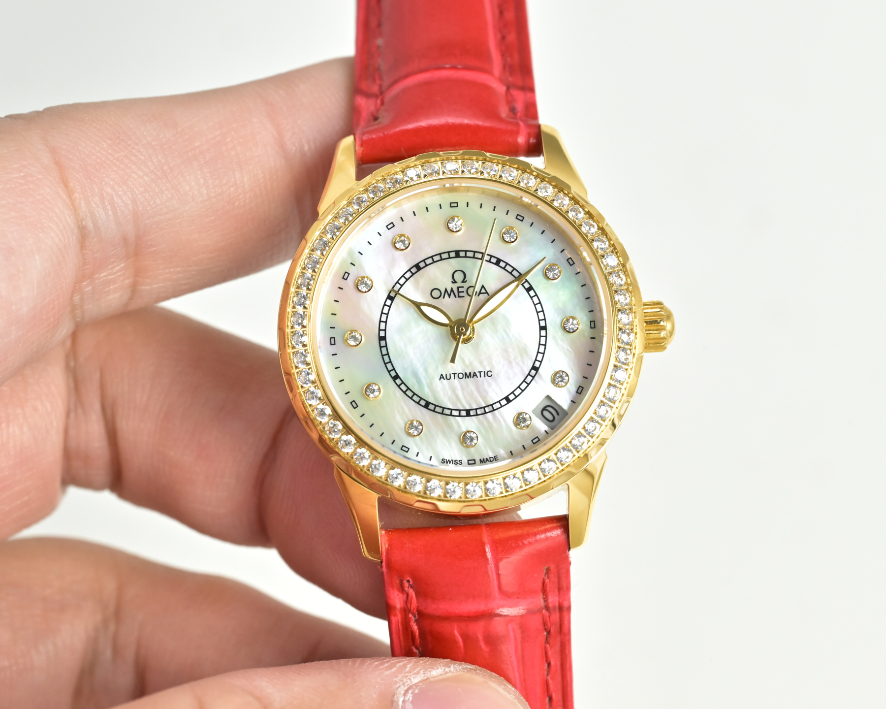 Omega De Ville Prestige gold case, diamond bezel, white dial, red leather strap 27mm Women's Automatic