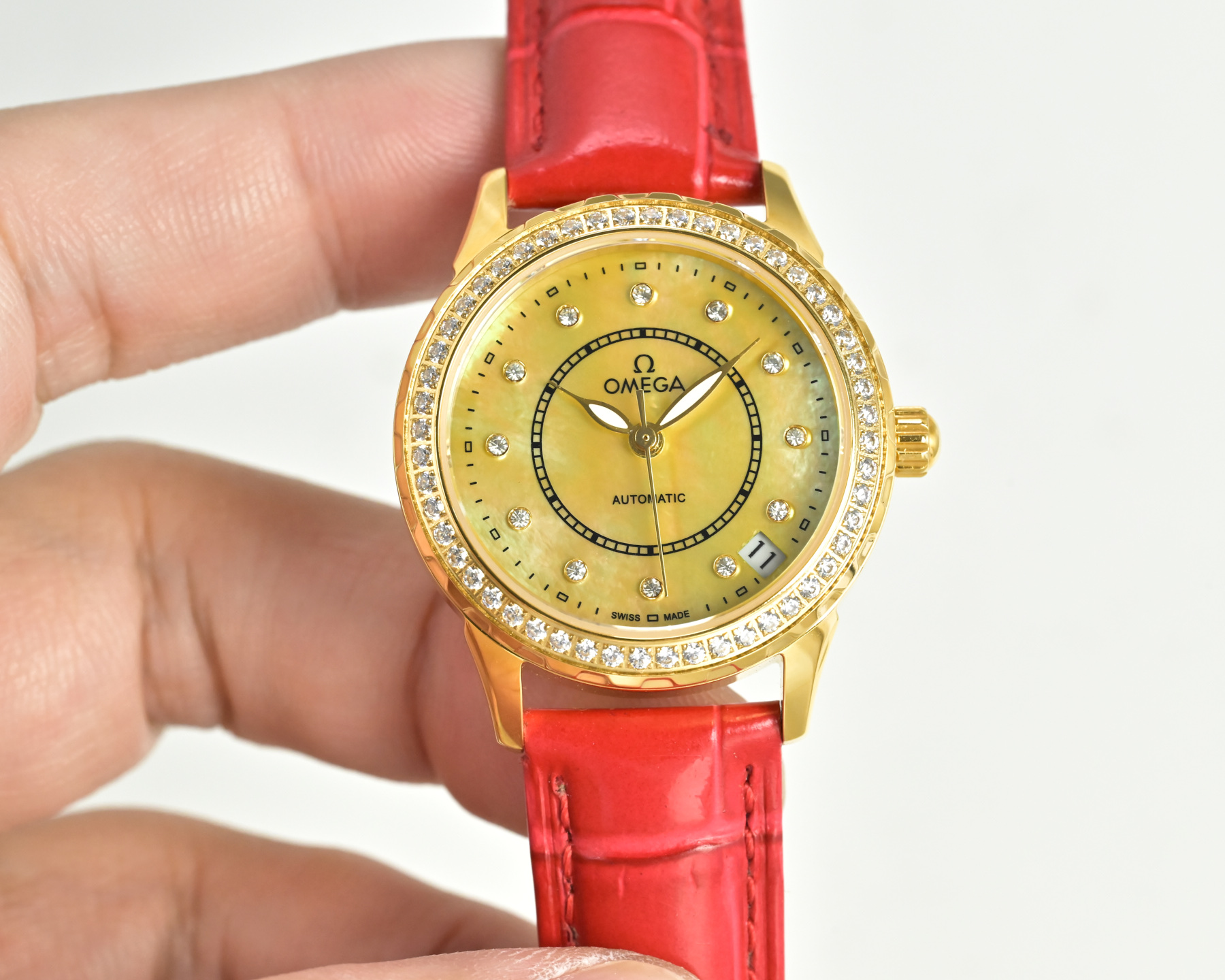 Omega De Ville Prestige gold case, diamond bezel, white dial, red leather strap 27mm Women's Automatic
