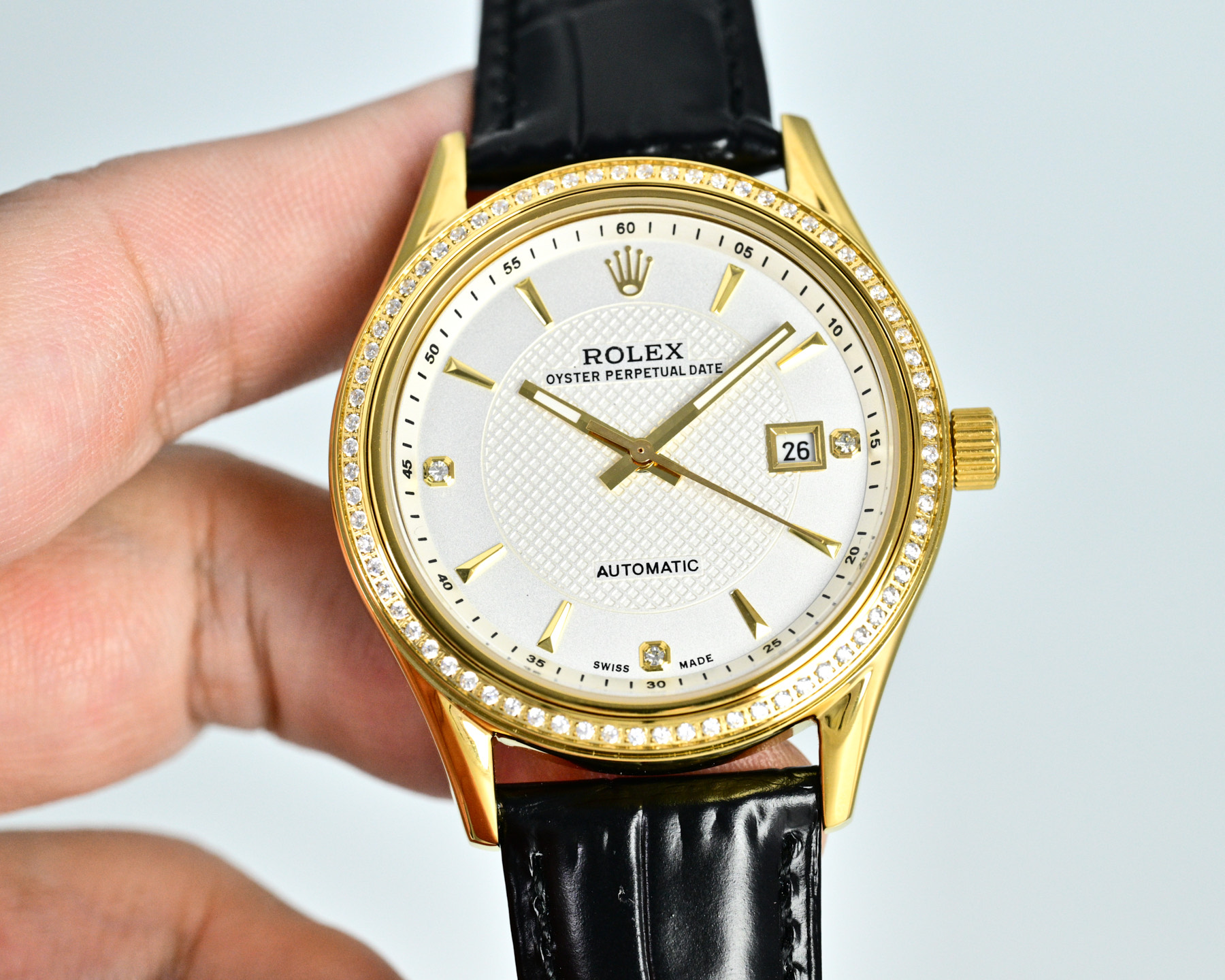 Rolex Oyster Perpetual Date champagne dial / gold case / brown leather strap 34mm Men's Automatic