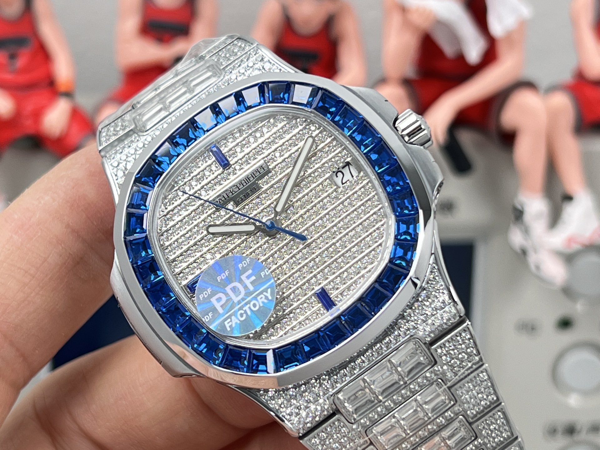 Patek Philippe Nautilus 5711 / 110P-001 platinum case, blue sapphire bezel, silver diamond-paved dial, platinum diamond-set bracelet 40mm Men's Automatic