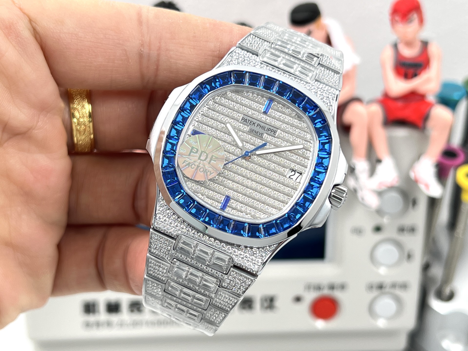 Patek Philippe Nautilus 5711 / 110P-001 platinum case, blue sapphire bezel, silver diamond-paved dial, platinum diamond-set bracelet 40mm Men's Automatic