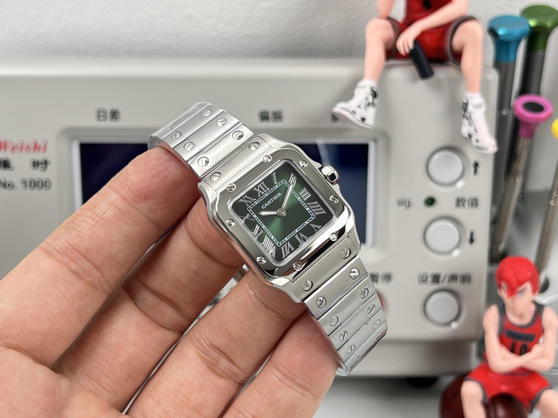 Cartier Santos de Cartier stainless steel case and bracelet, silver bezel, black dial 27mm Women's Quartz