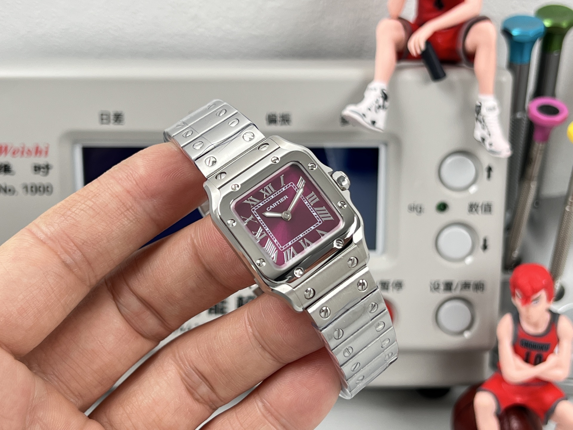 Cartier Santos de Cartier stainless steel case and bracelet, silver bezel, black dial 27mm Women's Quartz