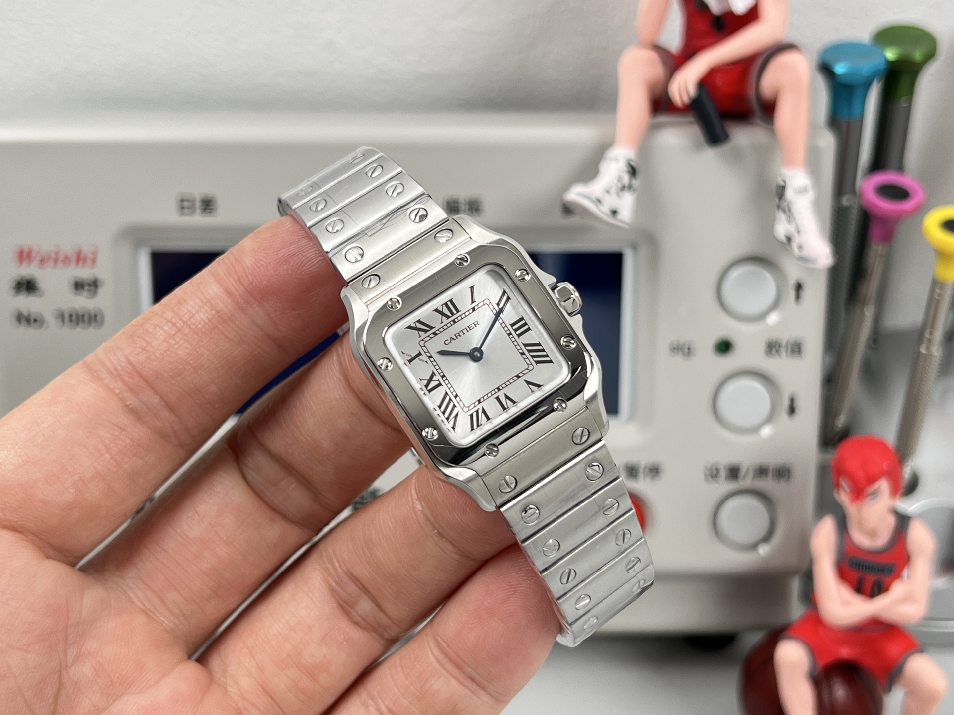 Cartier Santos de Cartier WSSA0082 stainless steel case and bezel, silver dial, stainless steel bracelet 27mm Women's Quartz