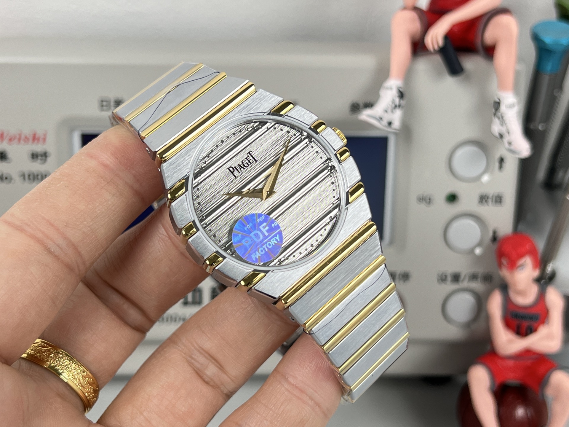 Piaget Possibly Polo or similar oval / tonneau bracelet watch gold-tone case and bracelet, white dial, blue accent 24mm Women's Quartz