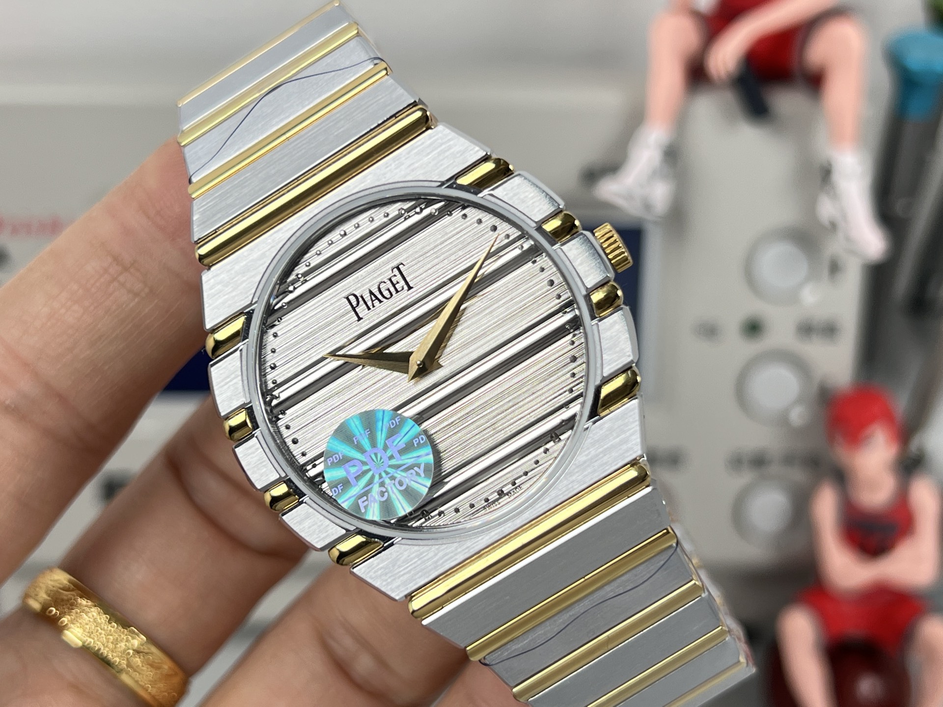 Piaget Possibly Polo or similar oval / tonneau bracelet watch gold-tone case and bracelet, white dial, blue accent 24mm Women's Quartz