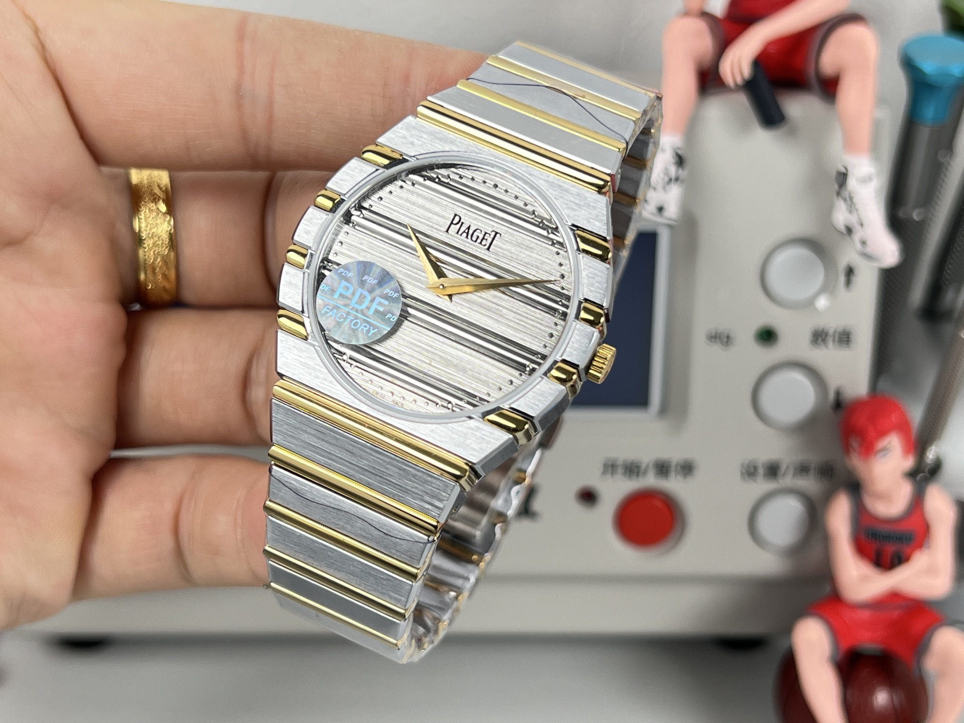 Piaget Possibly Polo or similar oval / tonneau bracelet watch gold-tone case and bracelet, white dial, blue accent 24mm Women's Quartz