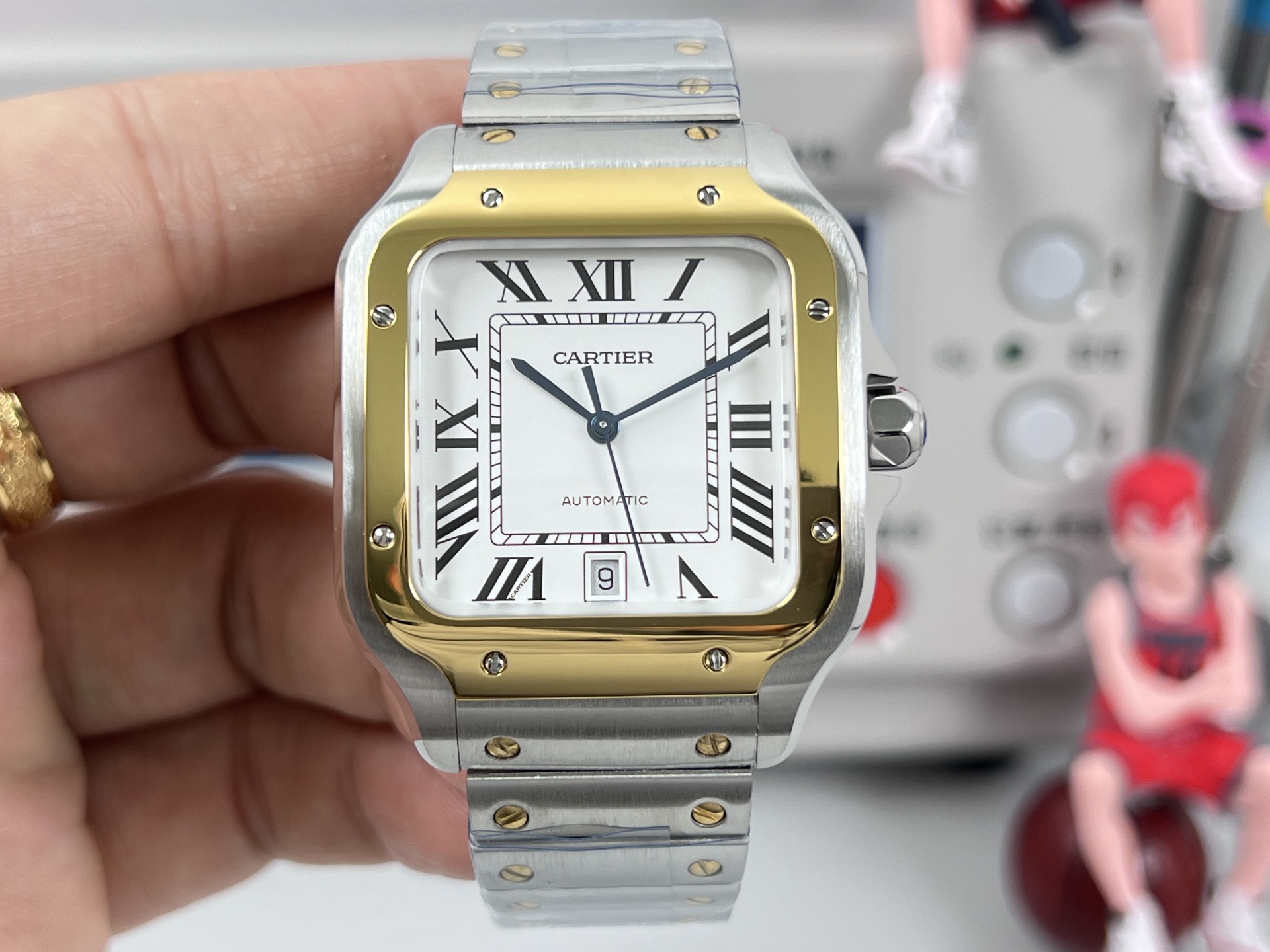 Cartier Santos de Cartier two-tone steel and yellow gold case / bezel, black dial, steel and gold bracelet 40mm Men's Automatic