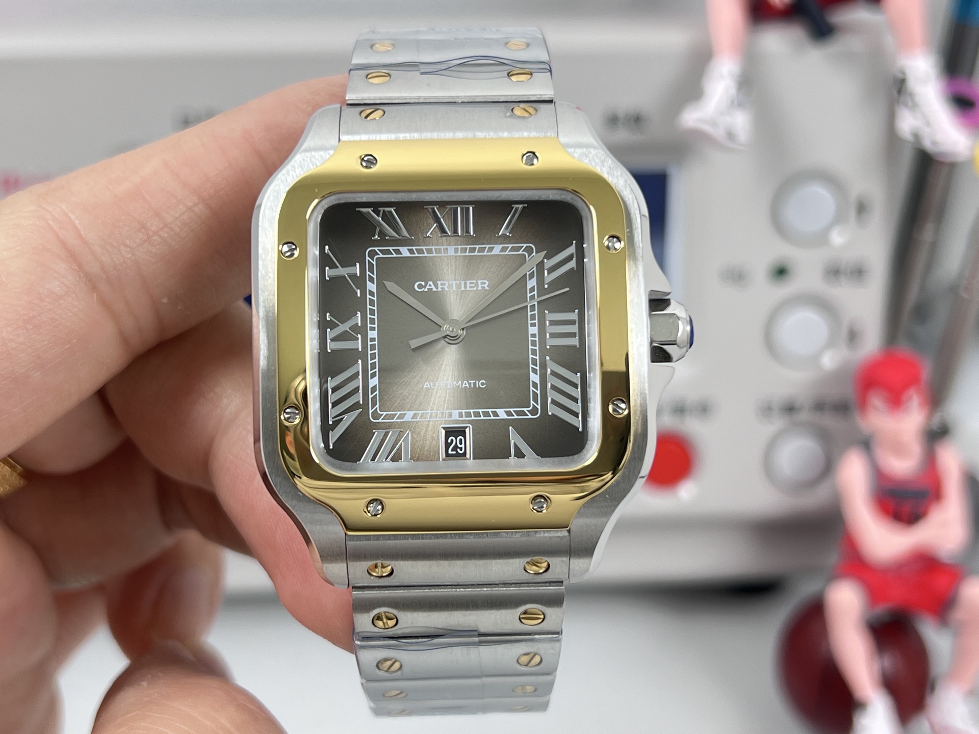 Cartier Santos de Cartier two-tone steel and yellow gold case / bezel, black dial, steel and gold bracelet 40mm Men's Automatic