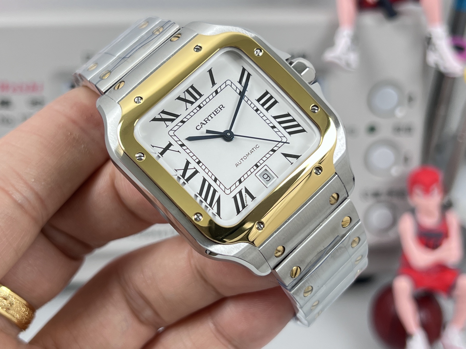 Cartier Santos de Cartier two-tone steel and yellow gold case / bezel, black dial, steel and gold bracelet 40mm Men's Automatic