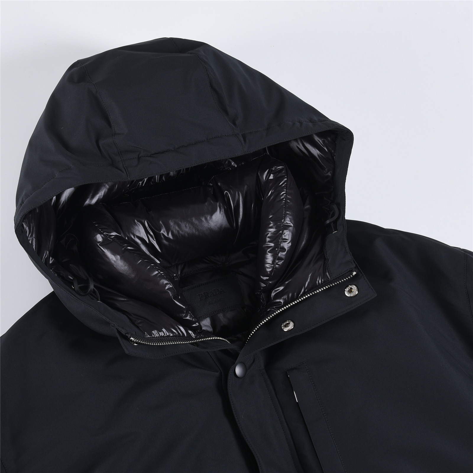 #正品级:𝑷𝒓𝒂𝒅𝒂|普拉达𝑭𝑾25 秋冬新品轻奢休闲超宽松版型中长款连帽羽绒服男女款## 𝑺𝒊𝒛𝒆:𝟰