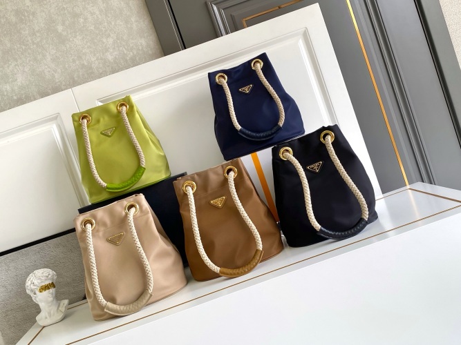 Prada Re-Nylon Bucket Bag with Rope Handle and Enamel Triangle Logo 1 Prada Re-Nylon Bucket Bag with Rope Handle and Enamel Triangle Logo