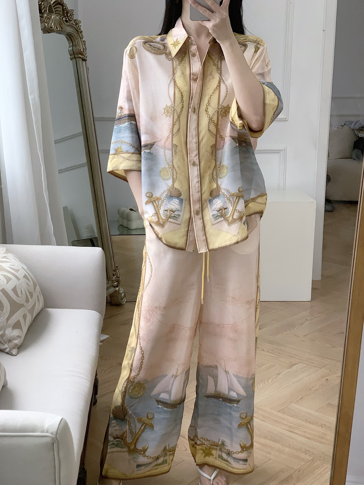 Zimmerman Soft pink base blended with gilded nautical motifs