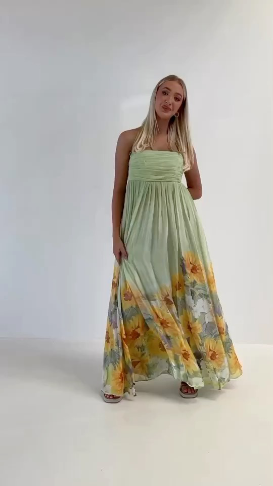 Zimmerman This light green floor-length dress features a strapless design as...