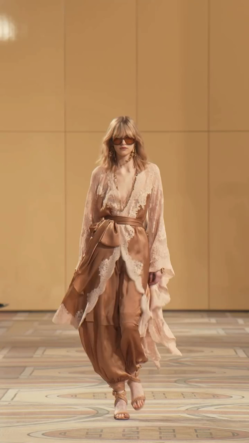 Zimmerman In front of the warm-toned backdrop of the runway