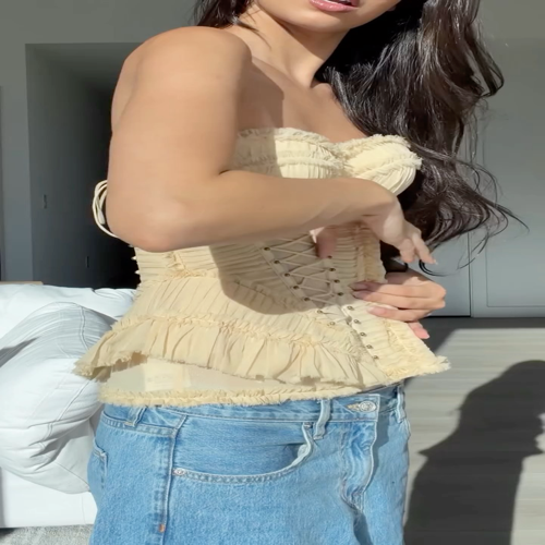 Zimmerman The textured folds of the pale apricot corset camisole collide with...