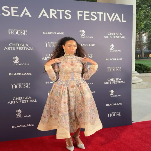 Zimmerman In front of the backdrop of the Chelsea Arts Festival