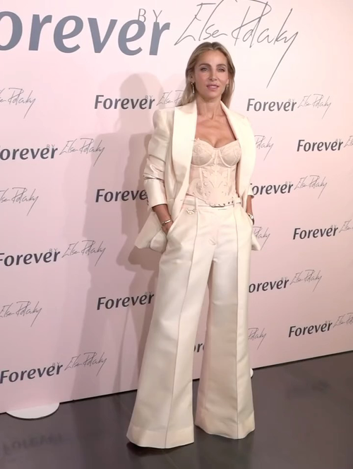 Zimmerman The silhouette of the off-white satin blazer outlines crisp lines