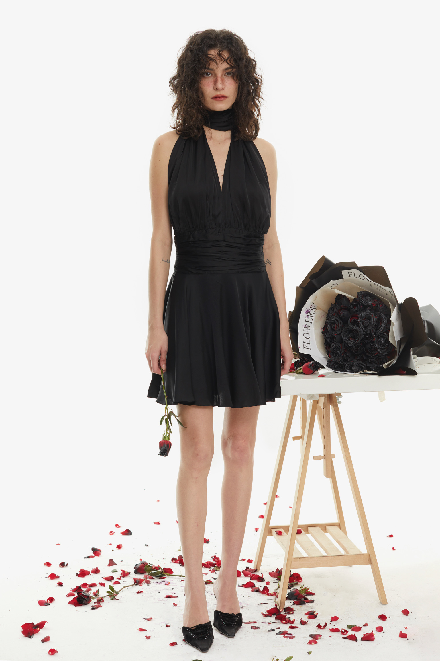 Zimmerman This convertible black mini dress is conceived as a canvas of fluid...