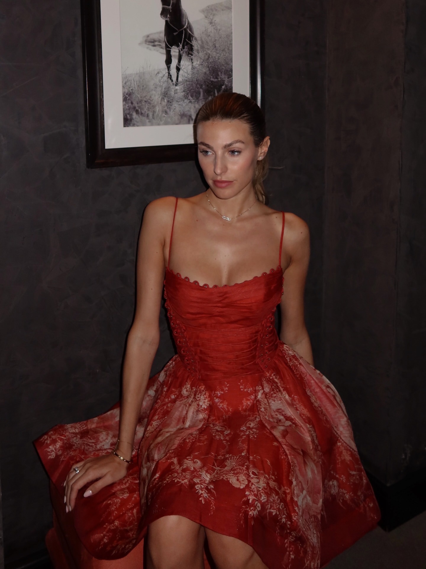 Zimmerman This red dress is the silent focal point of the room