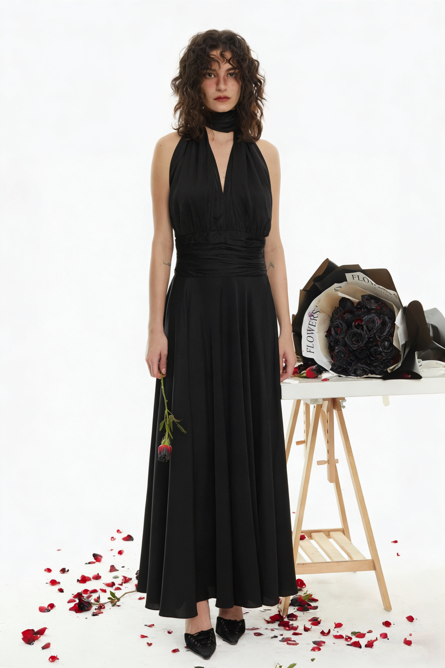 Zimmerman Black dress as the curtain, roses as the preface.
