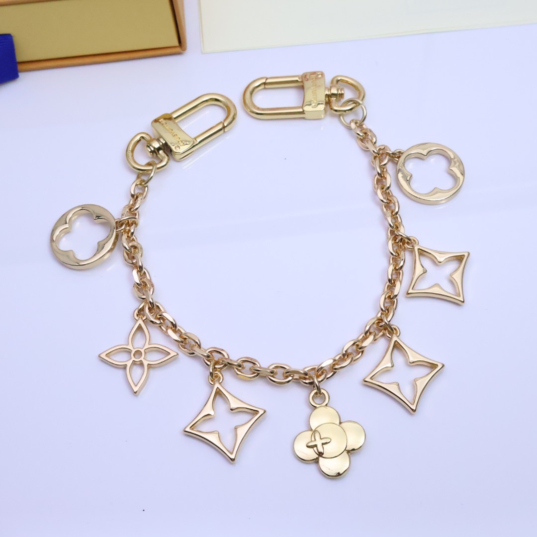 Gold Fleur de Monogram bag charm front view