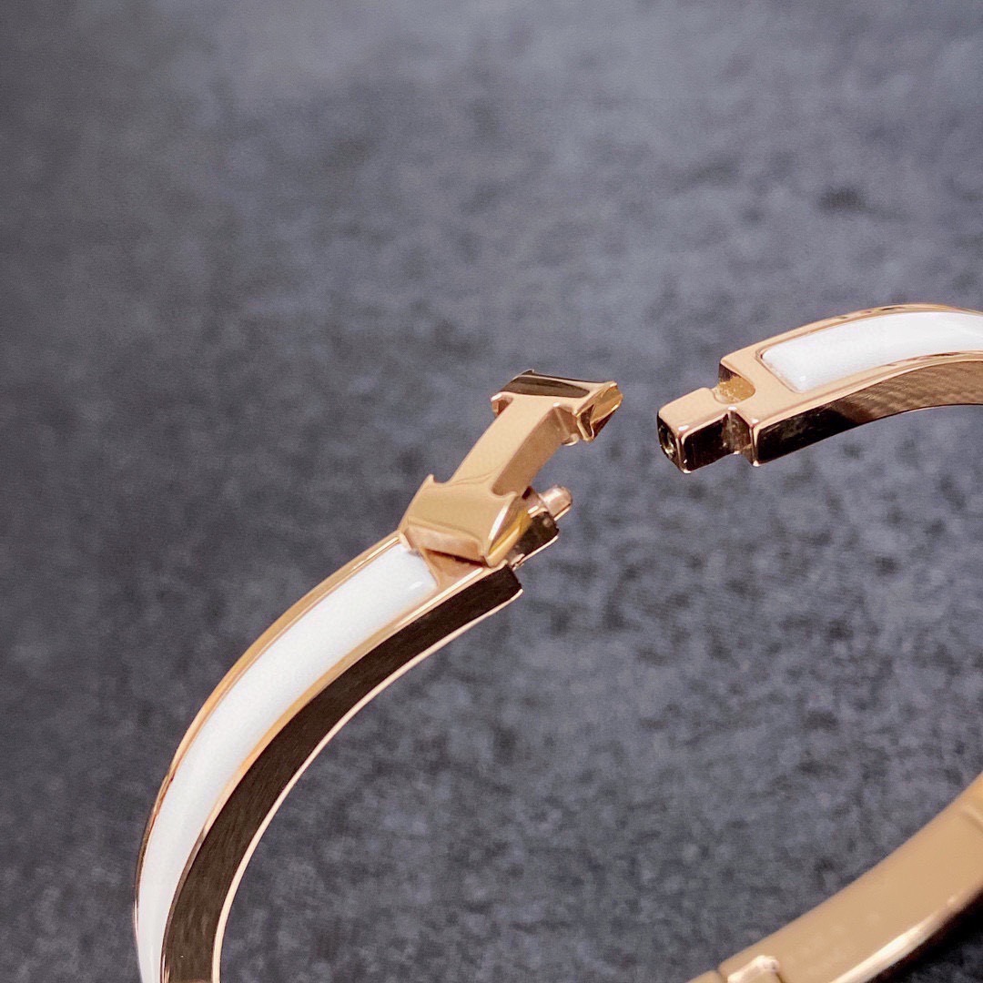 Bracelet Hermes Clic H métal doré rose et émail blanc MM