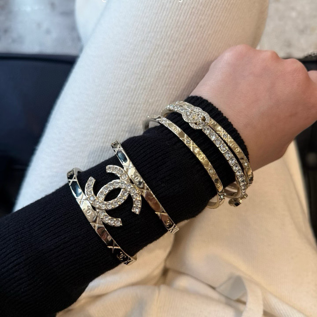 Chanel CC Logo Quilted Crystal Cuff bracelet gold-tone metal with clear crystal accents 17cm inner circumference