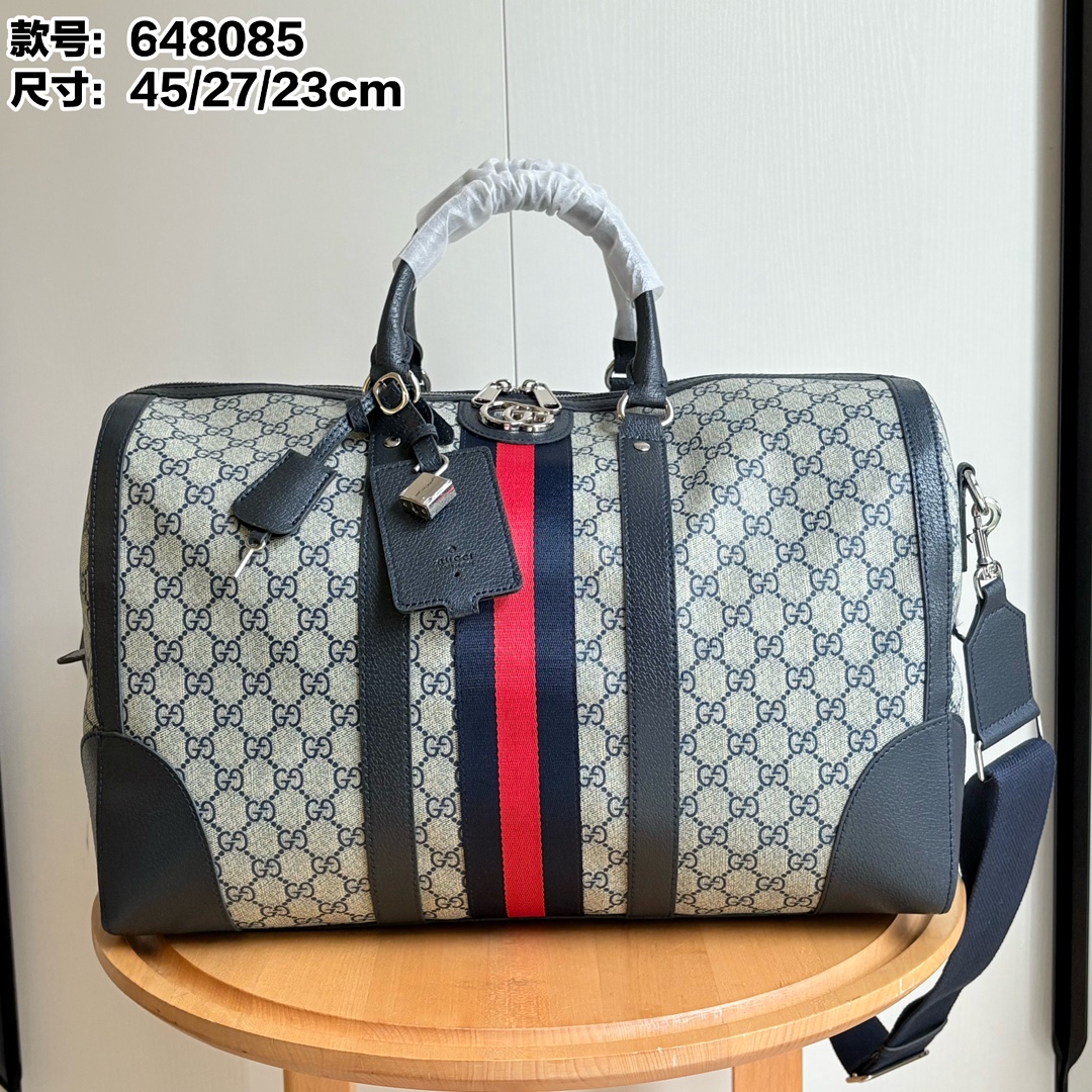 Toma real # Número de modelo: 648085 pegamento azul Tamaño: 45/27/23 Bolso de viaje clásico Ophidia equipado con correa…
