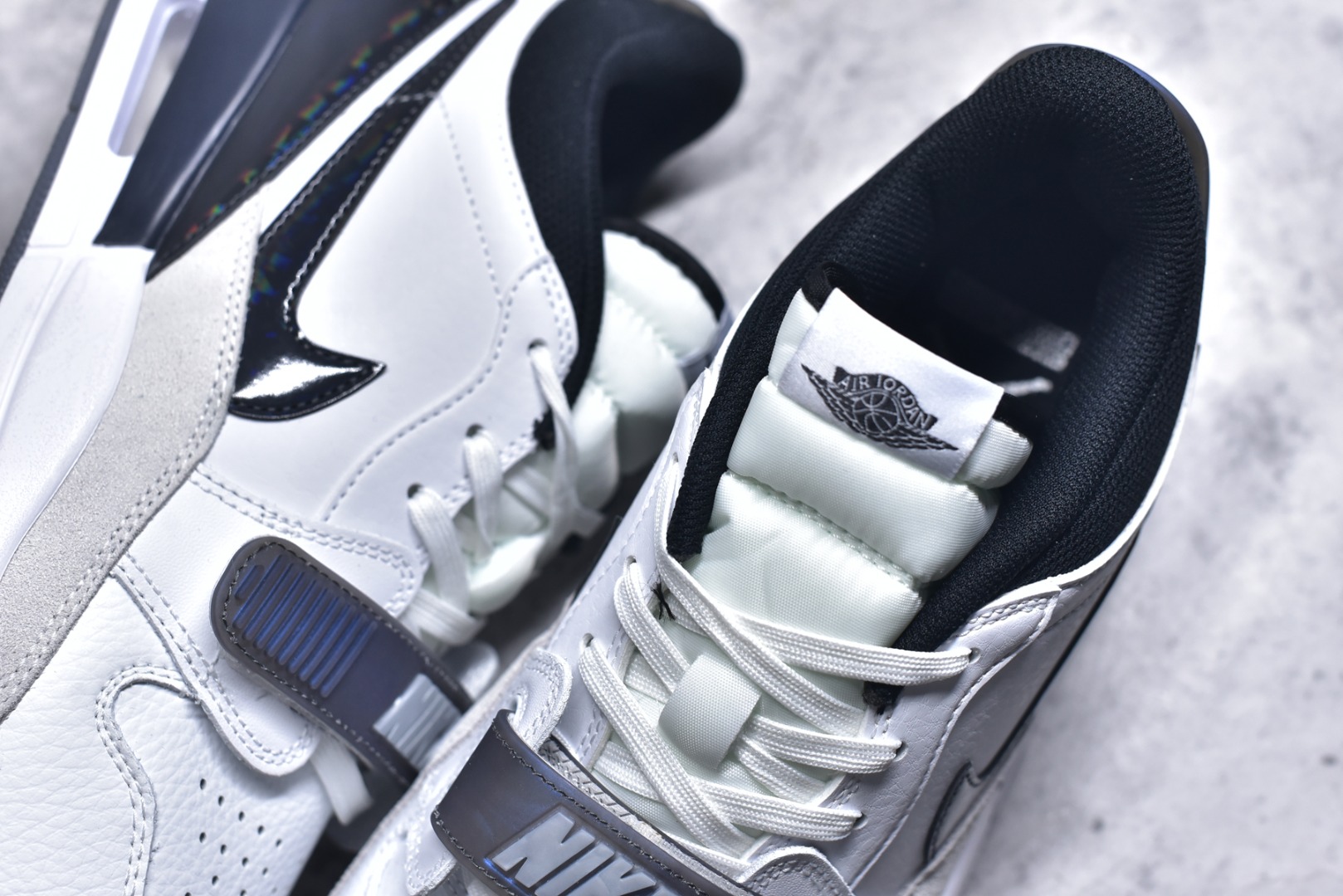 图片[9]-#开学季福利 Air Jordan Legacy AJ312 Low 低帮复古篮球鞋 市场最强独一档产物 全套原纸板楦头开发 原厂大底磨具加持立体防滑纹理 原档数据后跟TPU子母扣魔术贴 原装可视Air Sole气垫 原汁原味最完美的312代版型 唯一正确鞋头趴度弧度高度鞋身腰线 进口港宝加持 后跟自然饱满 全鞋荧光划线卡点 追求极致完美 每一双都是工艺品 多重QC质检 超越公司货的品控标准 实实在在的免检产品 鞋身采用了皮革材质打造 横跨鞋面的魔术贴十分吸睛 侧面的Swoosh Logo的一部分被鞋面遮挡了一部分 颇具玩味 魔术贴上标有NK标识 而鞋舌上是Jordan的经典红色飞翼Logo 后跟和鞋底均采用了AJ3的设计 后跟上同样也使用了经典的爆裂纹图案 尺码：36 36.5 37.5 38 38.5 39 40 40.5 41 42 42.5 43 44 44.5 45 46 47.5-选品中心