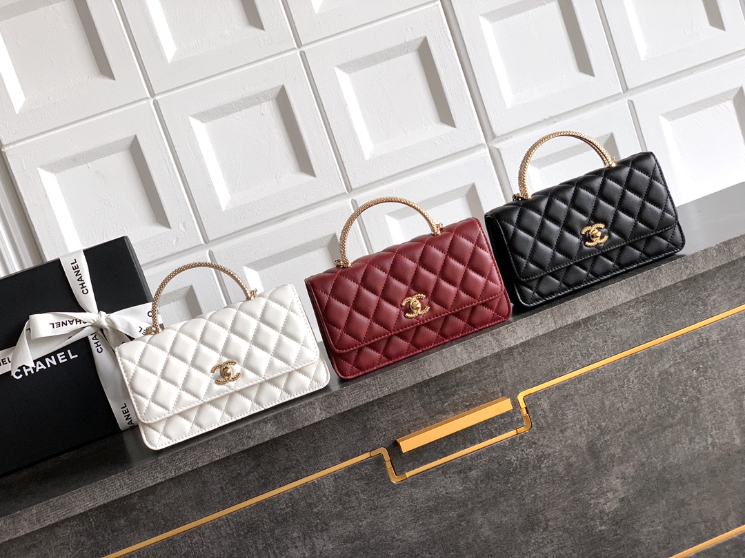 CHANEL Quilted Leather Flap Bag with Crystal Handle