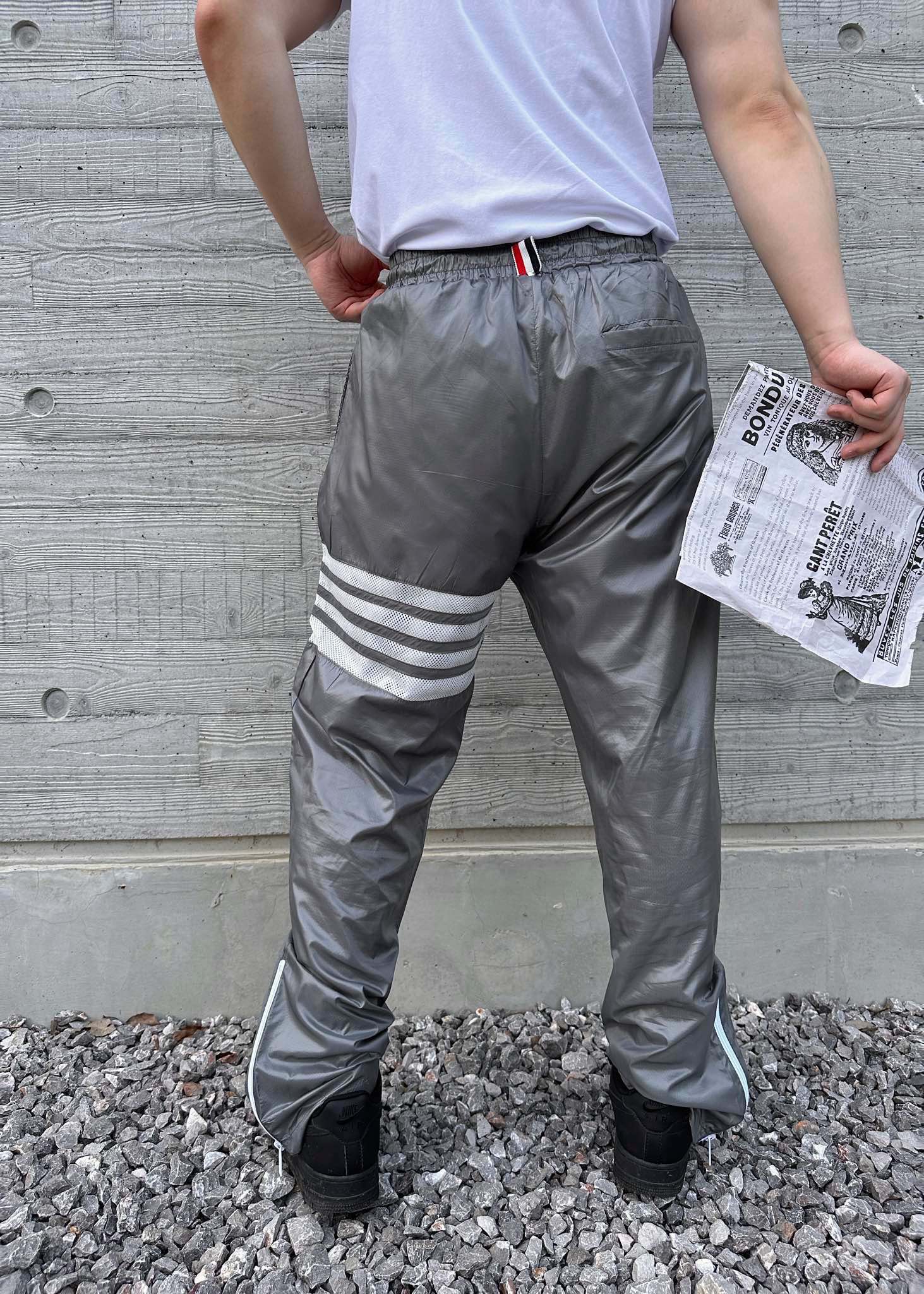 Thom BrowneTom Brown nylon woven trousers upper body effect